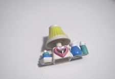 PRE-OWNED DOLLHOUSE MINIATURES PLASTIC LAMP AND BABY ITEMS W/ PINK GEM ADDED