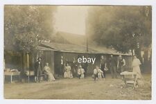 1915 circa. Neighbors gather with their dogs. Some Construction tools # 7 RPPC