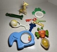 Vintage Baby Items Featuring A Fisher Price Elephant And A Playskool Honey Bee